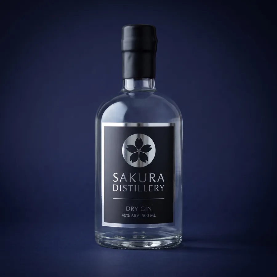 Gin bottle — Sticker label · metallic on a charcoal field